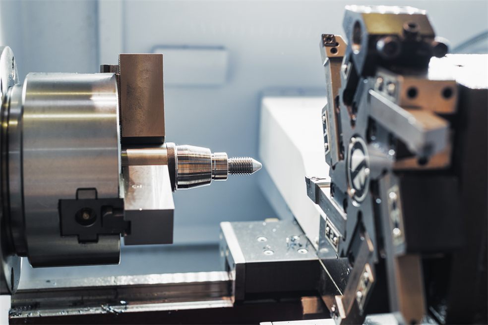 A rack of precision CNC tool holders and cutting bits in a machine shop